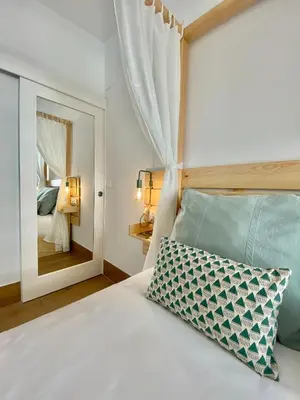 Cama o camas de una habitación en LOFT DELUXE ALMA GARDEN