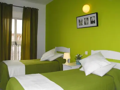 Cama o camas de una habitación en Hostal Santa Catalina