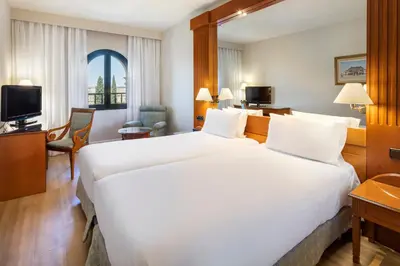 Cama o camas de una habitación en Exe Sevilla Macarena