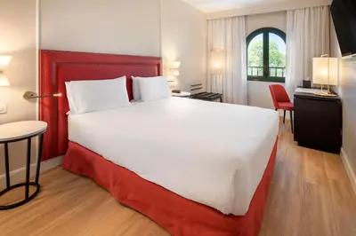 Cama o camas de una habitación en Exe Sevilla Macarena
