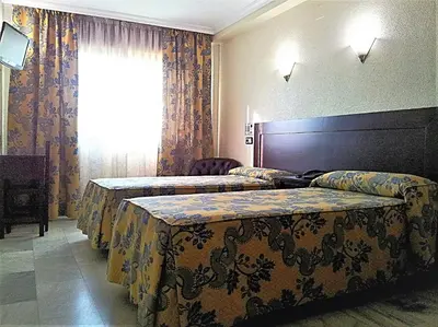 Cama o camas de una habitación en Hotel Averroes