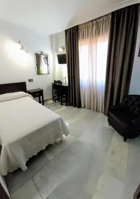 Cama o camas de una habitación en Hotel Averroes