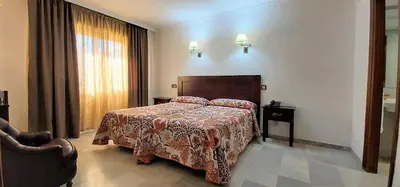 Cama o camas de una habitación en Hotel Averroes