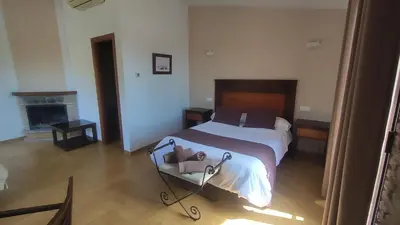 Cama o camas de una habitación en Hotel Rural Puerto Mágina