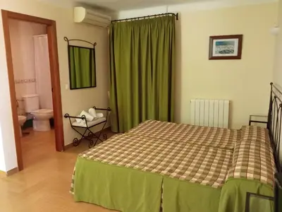 Cama o camas de una habitación en Hotel Rural Puerto Mágina