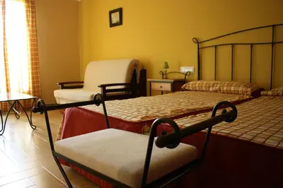 Cama o camas de una habitación en Hotel Rural Puerto Mágina