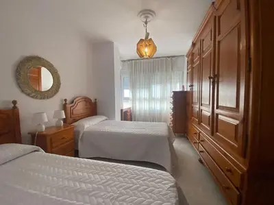 Cama o camas de una habitación en funcional piso 4 dormitorios frente a santa justa