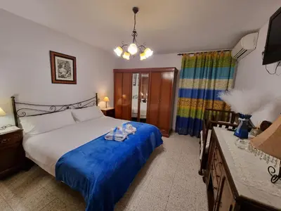 Cama o camas de una habitación en LA FUENTE ROMANA