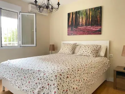 Cama o camas de una habitación en Hispalis Nervión