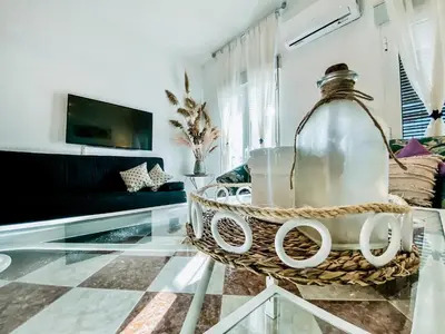 Una televisión o centro de entretenimiento en APARTAMENTOS FERNANDO III EL SANTO