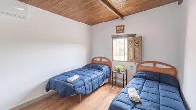 Cama o camas de una habitación en Cortijo Rural Los Pinos Villanueva de Algaidas by Ruralidays