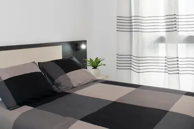 Cama o camas de una habitación en Deluxe Apartament Alcalá la Real