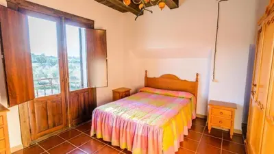 Cama o camas de una habitación en Cortijo Vaquero Rural Loja by Ruralidays