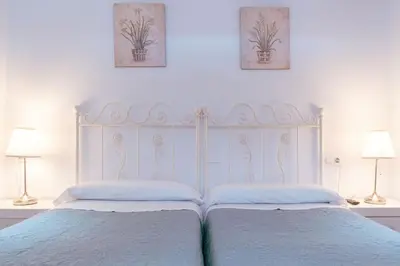 Cama o camas de una habitación en Apartamento con encanto en patio sevillano (202)