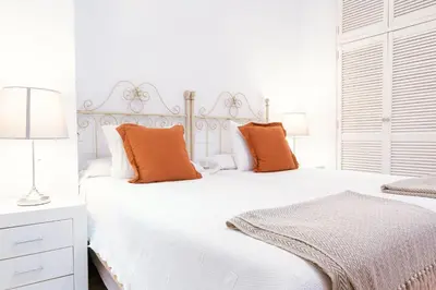 Cama o camas de una habitación en Apartamento con encanto en patio sevillano (203)