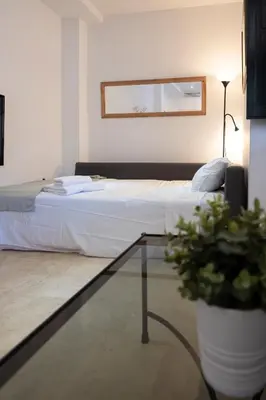 Cama o camas de una habitación en Apartamento con encanto en patio sevillano (204)