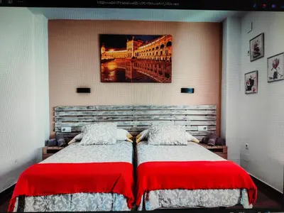 Cama o camas de una habitación en loft Alameda de Hercules