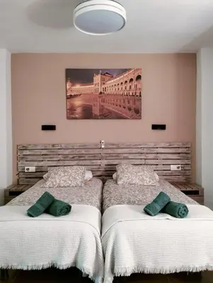 Cama o camas de una habitación en loft Alameda de Hercules