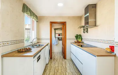 Una cocina o zona de cocina en Stunning Air Conditioned House