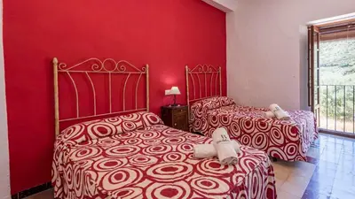 Cama o camas de una habitación en Cortijo El Llano Priego de Córdoba by Ruralidays