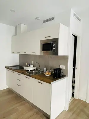 Una cocina o zona de cocina en Precioso Apartamento céntrico con piscina