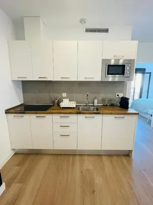 Una cocina o zona de cocina en Precioso Apartamento céntrico con piscina