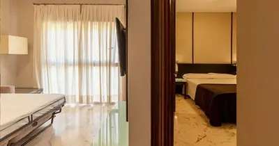 Cama o camas de una habitación en Apartamentos Vértice Bib Rambla