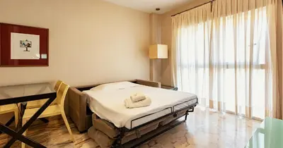 Cama o camas de una habitación en Apartamentos Vértice Bib Rambla