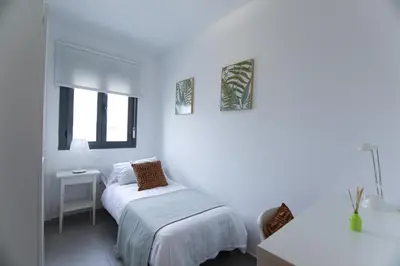 Cama o camas de una habitación en RentalSevilla Clemente Hidalgo