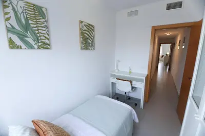 Cama o camas de una habitación en RentalSevilla Clemente Hidalgo