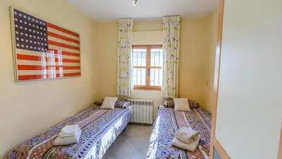 Cama o camas de una habitación en La Casa de Lú Archidona by Ruralidays