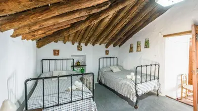 Cama o camas de una habitación en Huerta La Lapa Cañete la Real by Ruralidays