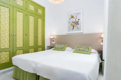Cama o camas de una habitación en Smartr Sevilla Las Dueñas