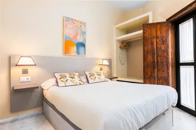 Cama o camas de una habitación en Smartr Sevilla Las Dueñas