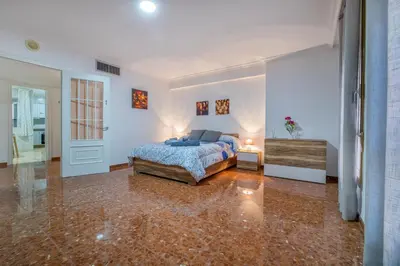 Cama o camas de una habitación en La Perla del Centro