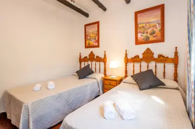 Cama o camas de una habitación en El Chorro Villas Casa Adelfa