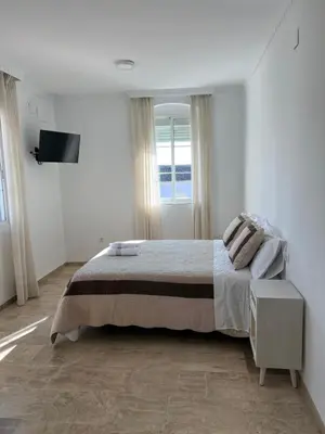 Cama o camas de una habitación en ATICO SUITE CLAUDIO MARCELO