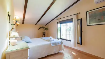 Cama o camas de una habitación en Alojamiento Rural la Aragonesa Marmolejo by Ruralidays