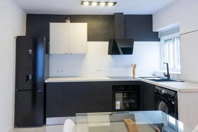 Una cocina o zona de cocina en Apartamento completo a 5 minutos estación tren.