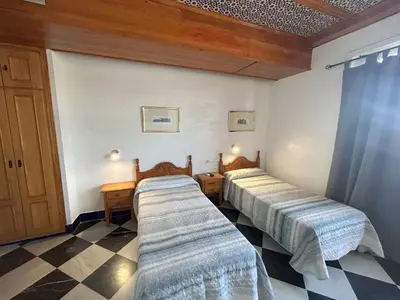 Cama o camas de una habitación en Hostal el Ancla