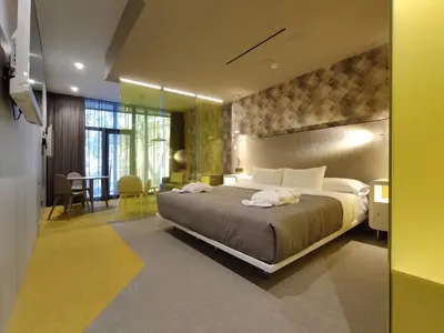 Cama o camas de una habitación en Hotel Macià Sevilla Kubb