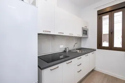 Una cocina o zona de cocina en BHost - Regina V