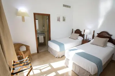 Cama o camas de una habitación en Hotel San Miguel