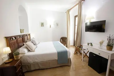 Cama o camas de una habitación en Hotel San Miguel