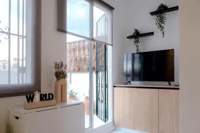 Una televisión o centro de entretenimiento en Ático Exclusivo con terraza en Santa Catalina