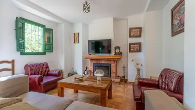Una televisión o centro de entretenimiento en Casa Ginés Iznájar by Ruralidays
