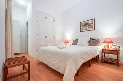 Cama o camas de una habitación en Alejo Fernandez Dreams de Santa Cruz Oasis Sevilla