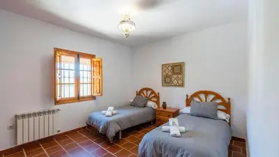 Cama o camas de una habitación en Huerta Abuela María Archidona by Ruralidays