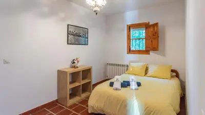 Cama o camas de una habitación en Huerta Abuela María Archidona by Ruralidays