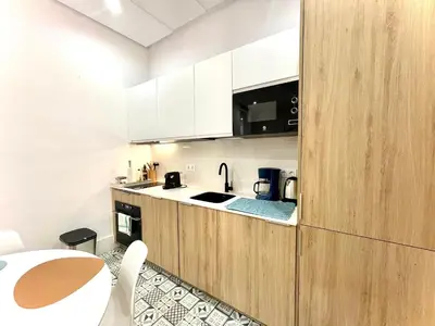 Una cocina o zona de cocina en Appartement Neuf avec Rooftop 69 M2 - STAYINSEVILLE